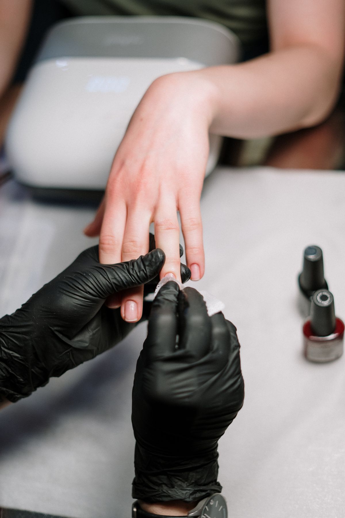 Manicure in progress at a nail salon